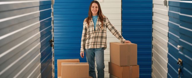 Woman standing with boxes