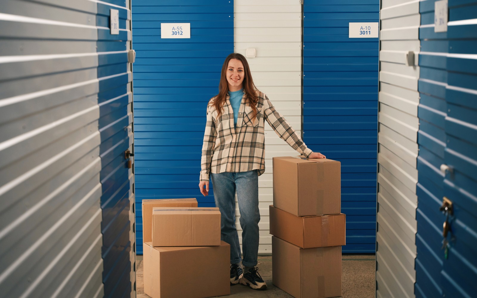 Woman standing with boxes