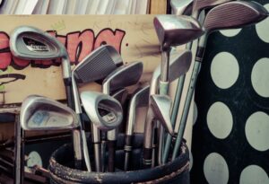 Golf clubs stored in a storage unit